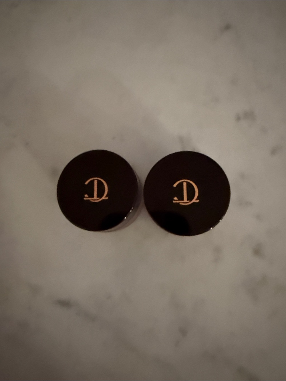 Charlotte Tilbury Black and Gold Compact Caps